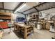 Well-equipped workshop with various tools and workbenches at 510 E Desert Hills Estate Dr, Phoenix, AZ 85086