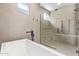 Spa-like bathroom with a soaking tub and a large walk-in shower at 5740 E Moura Dr, Cave Creek, AZ 85331