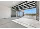 Garage with glass door offering views of the neighborhood at 5740 E Moura Dr, Cave Creek, AZ 85331