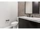 Modern bathroom with gray tile and floating vanity at 5748 E Moura Dr, Cave Creek, AZ 85331