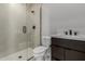 Modern bathroom with glass shower and dark vanity at 5748 E Moura Dr, Cave Creek, AZ 85331