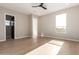 Light-filled bedroom with hardwood floors and access to a private balcony at 5748 E Moura Dr, Cave Creek, AZ 85331