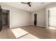 Bright bedroom featuring hardwood floors and ample closet space at 5748 E Moura Dr, Cave Creek, AZ 85331