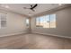 Bright bedroom featuring hardwood floors and a large window at 5748 E Moura Dr, Cave Creek, AZ 85331