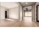 Bright hallway with light hardwood floors, leading to other rooms at 5748 E Moura Dr, Cave Creek, AZ 85331