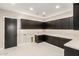 Laundry room with ample counter space and dark cabinetry at 5748 E Moura Dr, Cave Creek, AZ 85331