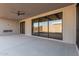 Covered patio with ceiling fan and sliding glass doors at 5748 E Moura Dr, Cave Creek, AZ 85331