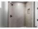 Modern shower with glass enclosure and gray tile at 5748 E Moura Dr, Cave Creek, AZ 85331