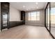 Modern wine room featuring built-in cabinetry and a wine refrigerator at 5748 E Moura Dr, Cave Creek, AZ 85331