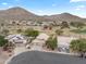 Community view showing houses near a golf course and mountains at 6210 W Foothill Dr, Glendale, AZ 85310