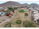 Aerial view showing homes surrounding a golf course at 6210 W Foothill Dr, Glendale, AZ 85310