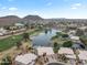 Aerial view of homes and a lake in a golf course community at 6210 W Foothill Dr, Glendale, AZ 85310