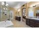 Large bathroom with dual vanities and a view into the bedroom at 6210 W Foothill Dr, Glendale, AZ 85310