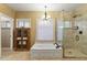 Elegant bathroom with soaking tub, walk-in shower, and a large window at 6210 W Foothill Dr, Glendale, AZ 85310