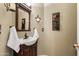 Elegant bathroom with dark wood vanity and white sink at 6210 W Foothill Dr, Glendale, AZ 85310