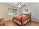 Bedroom with iron bed frame and ceiling fan at 6210 W Foothill Dr, Glendale, AZ 85310