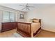 Bright bedroom with wood floors and a ceiling fan at 6210 W Foothill Dr, Glendale, AZ 85310