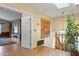 Upstairs hallway with built-in shelving and wooden staircase at 6210 W Foothill Dr, Glendale, AZ 85310