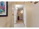 Bright hallway with tile flooring and neutral walls at 6210 W Foothill Dr, Glendale, AZ 85310