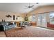 Living room with vaulted ceiling and access to patio at 6210 W Foothill Dr, Glendale, AZ 85310