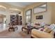 Spacious living room with built-in shelving and fireplace at 6210 W Foothill Dr, Glendale, AZ 85310