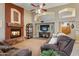 Bright living room featuring a fireplace and ample seating at 6210 W Foothill Dr, Glendale, AZ 85310