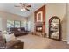 Cozy living room with a fireplace and large windows at 6210 W Foothill Dr, Glendale, AZ 85310