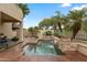 Relaxing pool and spa area with a stone waterfall feature at 6210 W Foothill Dr, Glendale, AZ 85310