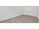 Simple bedroom with grey wood-look floors and white doors at 671 E Greenback Dr, San Tan Valley, AZ 85140