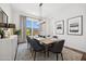 Elegant dining room with wood table and gray chairs at 671 E Greenback Dr, San Tan Valley, AZ 85140