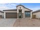 New construction home with a charming front porch and landscaping at 671 E Greenback Dr, San Tan Valley, AZ 85140