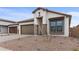 Single story home with modern facade and desert landscaping at 671 E Greenback Dr, San Tan Valley, AZ 85140