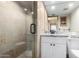 Bathroom with granite countertop, white cabinets, and a walk-in shower with stone tile at 7402 E Carefree Dr # 113, Carefree, AZ 85377