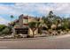 Exterior view of Carefree Terrace, showcasing the building's architecture and landscaping at 7402 E Carefree Dr # 113, Carefree, AZ 85377