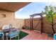 Private patio with wrought iron gate and terracotta tile floor at 7402 E Carefree Dr # 113, Carefree, AZ 85377