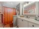 Bathroom with orange shower curtain and white vanity at 7529 E Windsor Ave, Scottsdale, AZ 85257