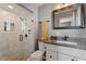 Bathroom with walk-in shower, granite vanity, and white cabinets at 7529 E Windsor Ave, Scottsdale, AZ 85257