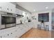 White kitchen with stainless steel appliances and herringbone backsplash at 7529 E Windsor Ave, Scottsdale, AZ 85257