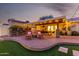 Outdoor patio with seating, bar, and string lights at 7529 E Windsor Ave, Scottsdale, AZ 85257