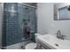 Modern bathroom with blue tile shower and updated vanity at 8227 E Hubbell St, Scottsdale, AZ 85257