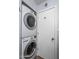 Stackable LG washer and dryer in a small laundry closet at 8227 E Hubbell St, Scottsdale, AZ 85257