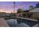 Stunning pool and spa surrounded by a beautifully landscaped backyard at 8227 E Hubbell St, Scottsdale, AZ 85257