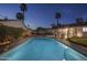 Night view of expansive backyard with pool and spa at 8227 E Hubbell St, Scottsdale, AZ 85257