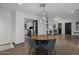 Modern dining area with wood flooring and a round wooden table at 840 W Earll Dr, Phoenix, AZ 85013