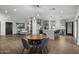 Open concept dining area with wood floors and kitchen view at 840 W Earll Dr, Phoenix, AZ 85013