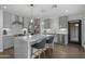 Modern kitchen with marble island and gray cabinetry at 840 W Earll Dr, Phoenix, AZ 85013