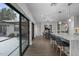 Modern kitchen with view of backyard oasis through sliding doors at 840 W Earll Dr, Phoenix, AZ 85013