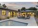 Relaxing patio with fire pit and modern seating, adjacent to a refreshing pool at 840 W Earll Dr, Phoenix, AZ 85013