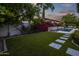 Backyard with a pool, fountain, and lush landscaping at 8400 E Columbus Ave, Scottsdale, AZ 85251