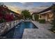 Luxury backyard oasis featuring a stunning pool, water features, and spacious patio at 8400 E Columbus Ave, Scottsdale, AZ 85251